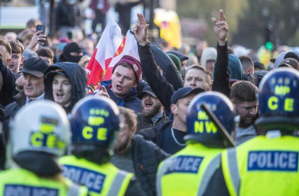 Counter-protesters clash with police in Parliament Square in central London, during a pro-Palestinian protest march which is taking place from Hyde Park to the U.S. embassy in Vauxhall, on Nov. 11, 2023. (Jeff Moore/PA)