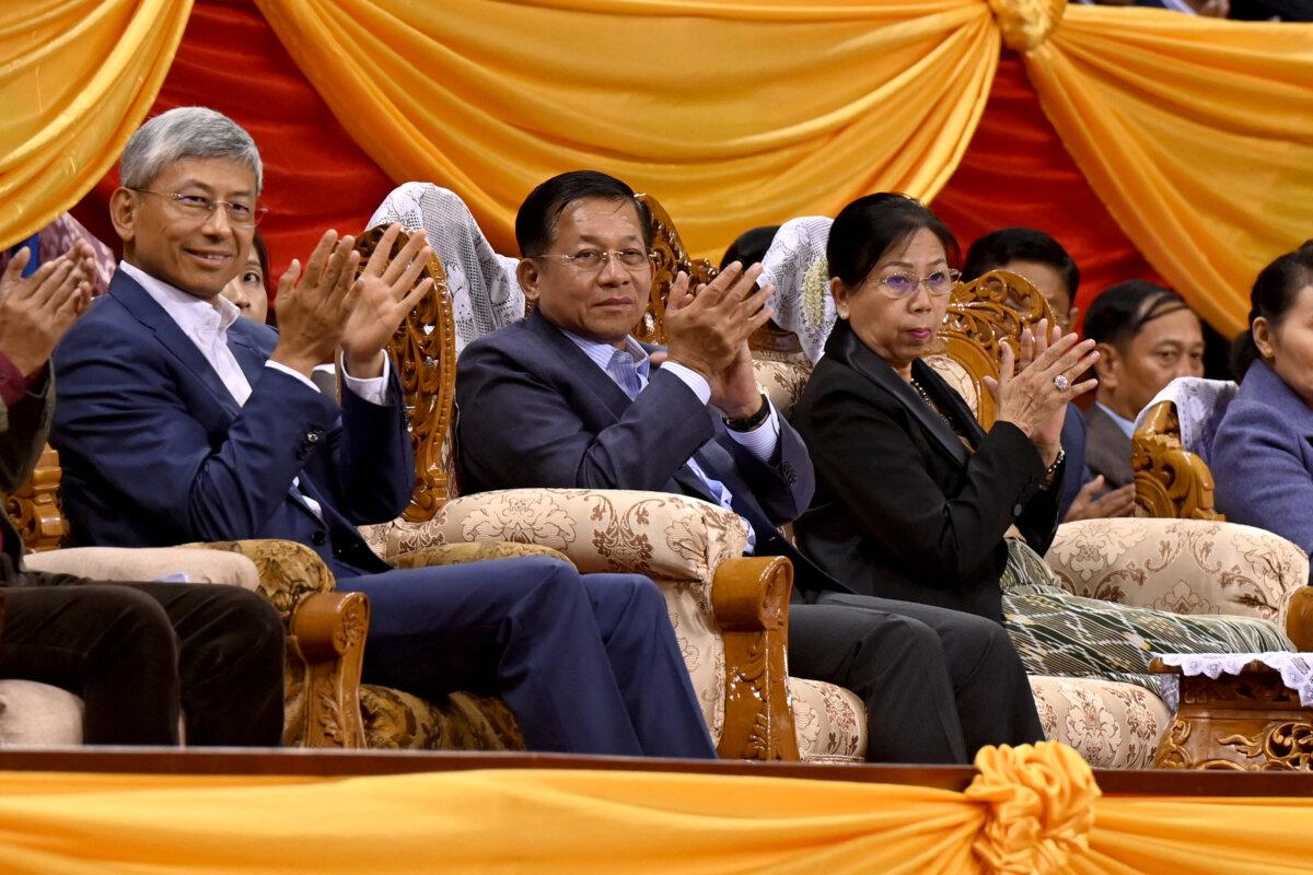 Burma's military chief, Min Aung Hlaing (C), along with his wife (R), and China's Ambassador to Burma Chen Hai (L) attend a ceremony on the eve of the Lunar New Year, in Yangon on Jan. 21, 2023. (AFP via Getty Images)