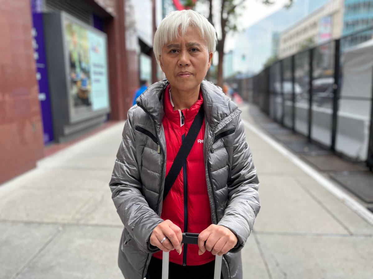 Human rights activist Ge Kaiying stands near the Moscone Center in San Francisco on Nov. 15, 2023. (Eva Fu/The Epoch Times)