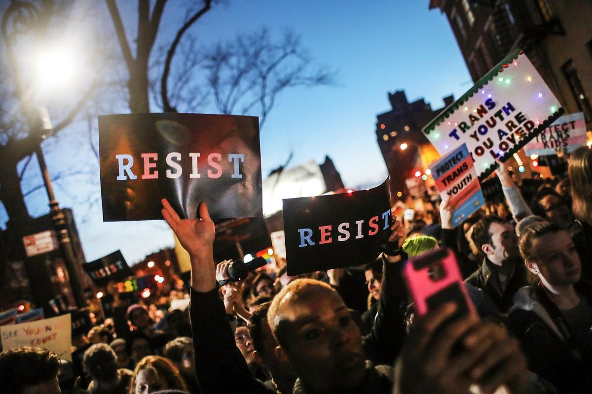 Activists and members of the transgender community gather outside an LGBT bar to protest a Trump administration policy that rescinds an Obama-era order allowing transgender students to use school bathrooms matching their gender identities, at the Stonewall Inn in New York City on Feb. 23, 2017. (Photo by Spencer Platt/Getty Images)