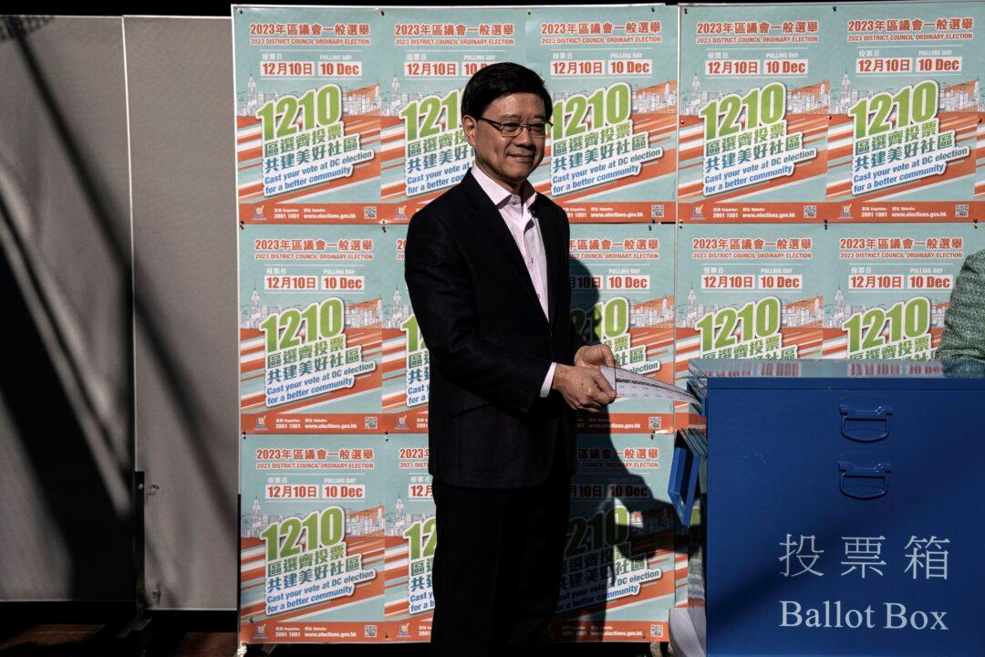 Hong Kong Holds 1st Council Elections Under New Rules That Shut Out Pro-Democracy Candidates, Activists Arrested