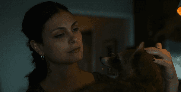 Marcie (Morena Baccarin) appreciates a romantically bequeathed dead raccoon, in “Fast Charlie.” (Vertical Entertainment)