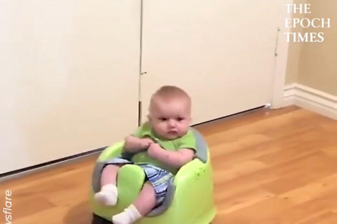 Cute Baby Rides a Robot Vacuum Cleaner