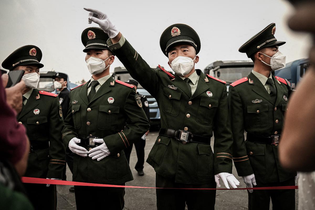 A soldier gestures in Tiananmen Square in Beijing on Oct. 1, 2022. (Noel Celis/AFP via Getty Images)