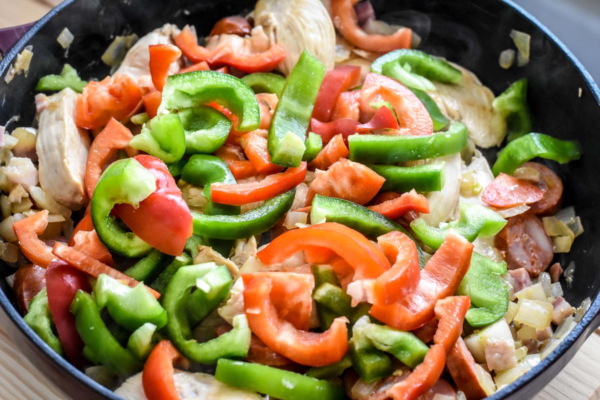 Stir in the bell peppers and cook for 2 to 3 minutes until slightly translucent. (Audrey Le Goff)