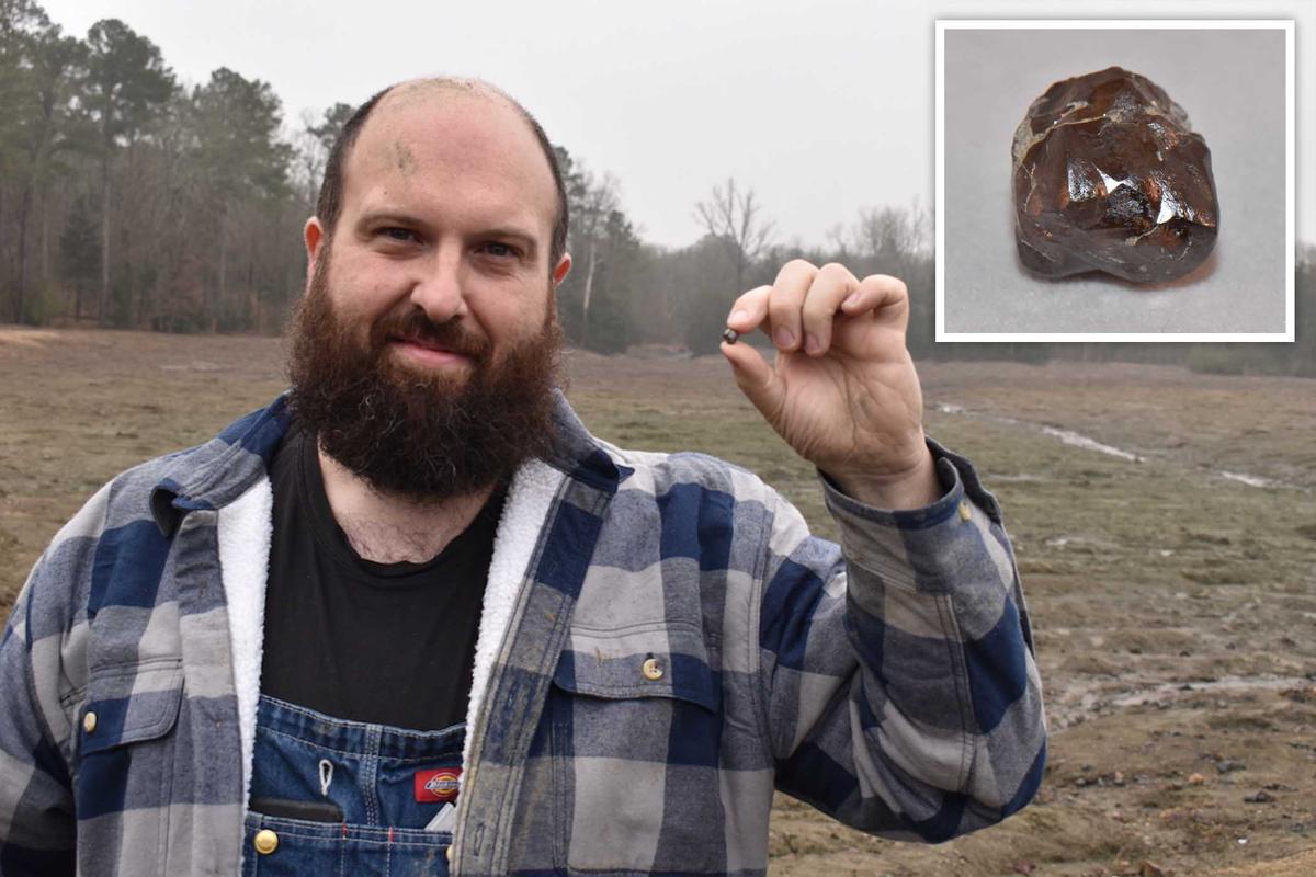 Mr. Navas from Paris, France, holds up his deep chocolate-colored brown diamond. (Courtesy of Crater of Diamonds State Park)