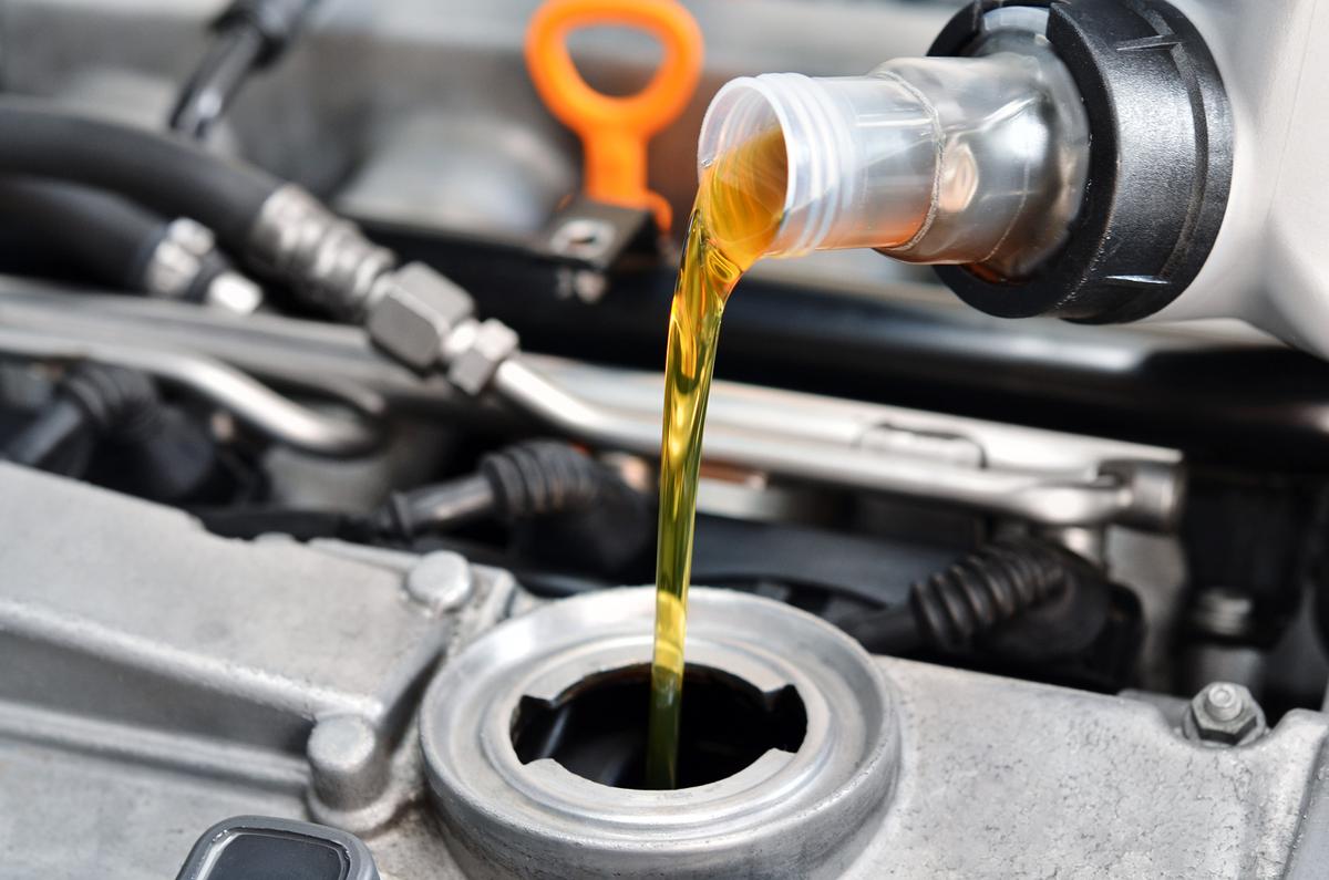 Motor oil is one of the most important automotive fluids to keep full, but take care to never overfill. Change it every 5,000 to 7,500 miles or annually. (Ensuper/Shutterstock)