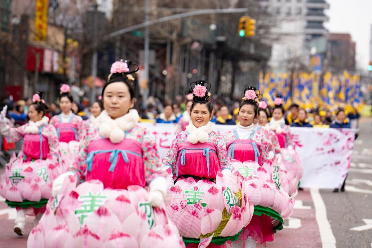 Falun Gong practitioners attend a parade celebrating the Chinese New Year in the Flushing neighborhood of Queens, N.Y., on Feb. 10, 2024. (Samira Bouaou/The Epoch Times)