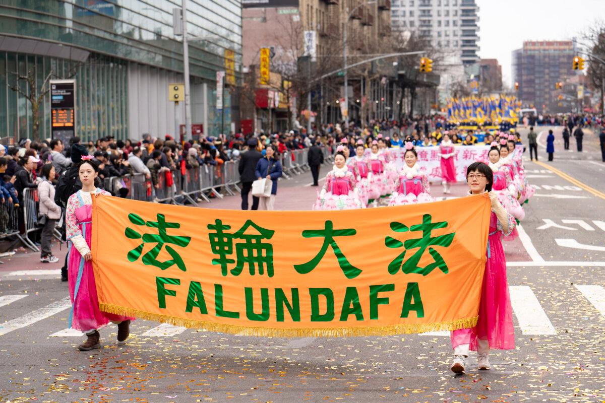 Falun Gong practitioners attend a parade celebrating the Chinese New Year in the Flushing neighborhood of Queens, N.Y., on Feb. 10, 2024. (Samira Bouaou/The Epoch Times)