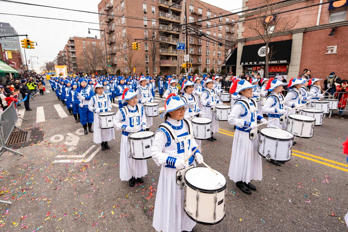 Falun Gong practitioners attend a parade celebrating the Chinese New Year in the Flushing neighborhood of Queens, N.Y., on Feb. 10, 2024. (Samira Bouaou/The Epoch Times)
