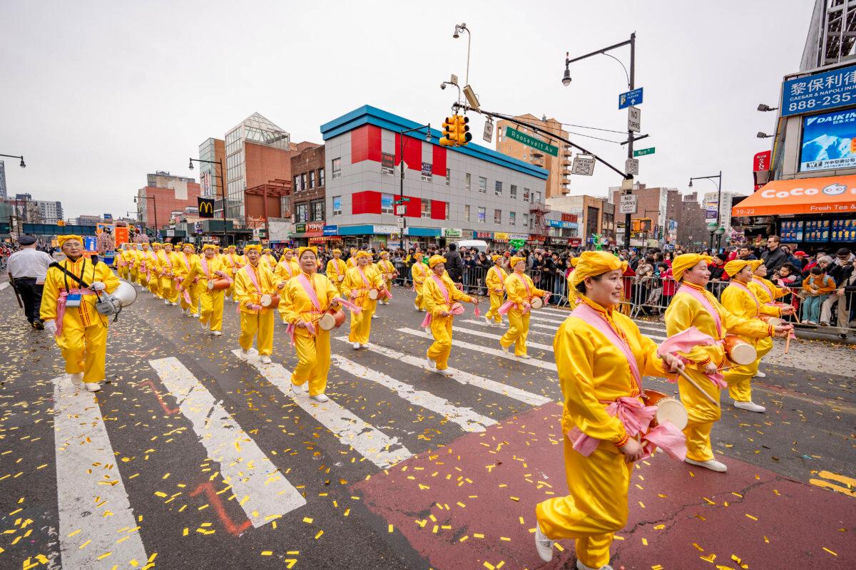 Falun Gong practitioners attend a parade celebrating the Chinese New Year in the Flushing neighborhood of Queens, N.Y., on Feb. 10, 2024. (Samira Bouaou/The Epoch Times)