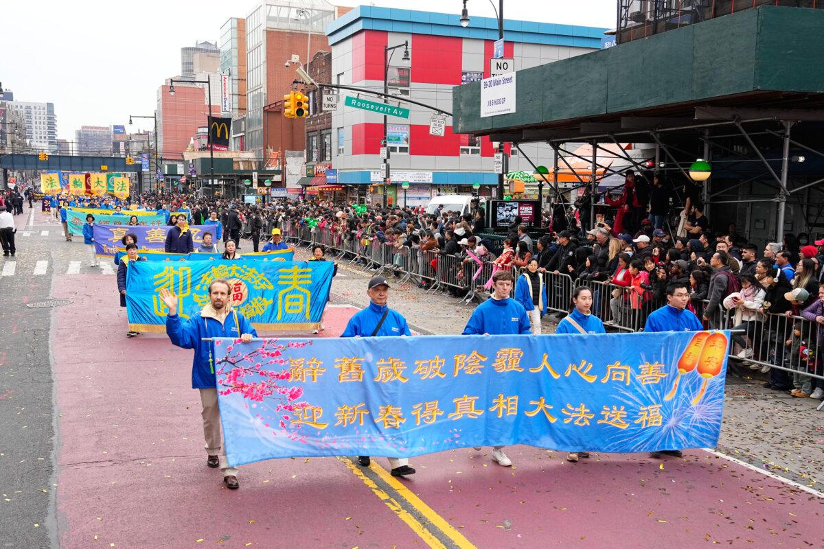 Falun Gong practitioners attend a parade celebrating the Chinese New Year in the Flushing neighborhood of Queens, N.Y., on Feb. 10, 2024. (Larry Dye/The Epoch Times)