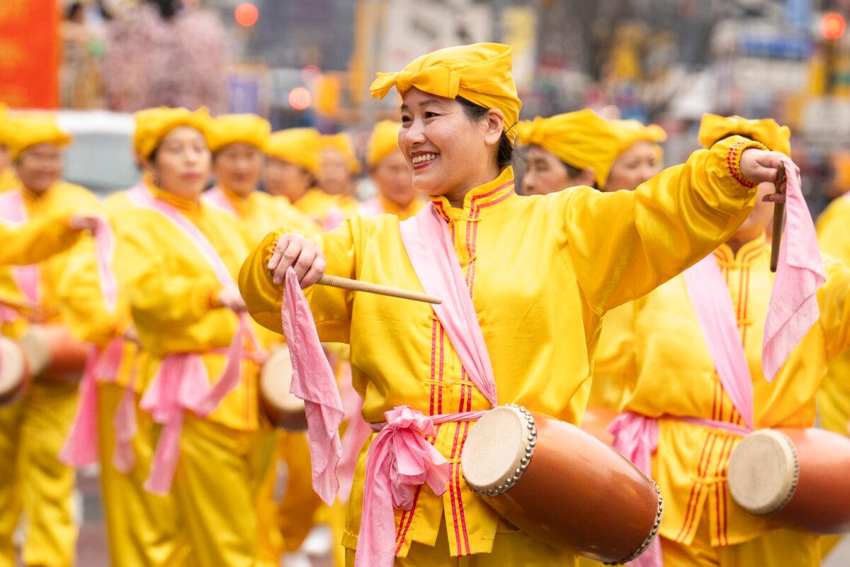 Falun Gong practitioners attend a parade celebrating the Chinese New Year in the Flushing neighborhood of Queens, N.Y., on Feb. 10, 2024. (Samira Bouaou/The Epoch Times)
