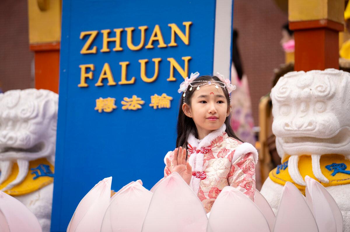 Falun Gong practitioners attend a parade celebrating the Chinese New Year in the Flushing neighborhood of Queens, N.Y., on Feb. 10, 2024. (Samira Bouaou/The Epoch Times)