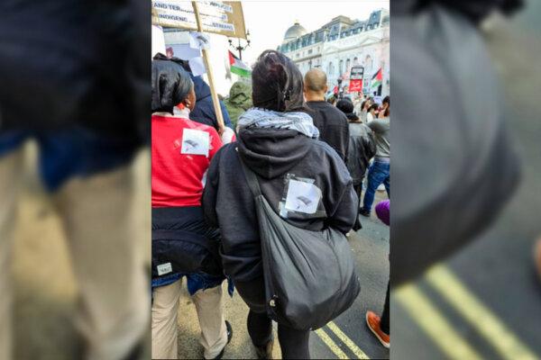 A screen grab of video footage of Pauline Ankunda (L) and Heba Alhayek (R) wearing images of parachutes during a pro-Palestinian rally in central London, on Oct. 14, 2023. (Metropolitan Police)