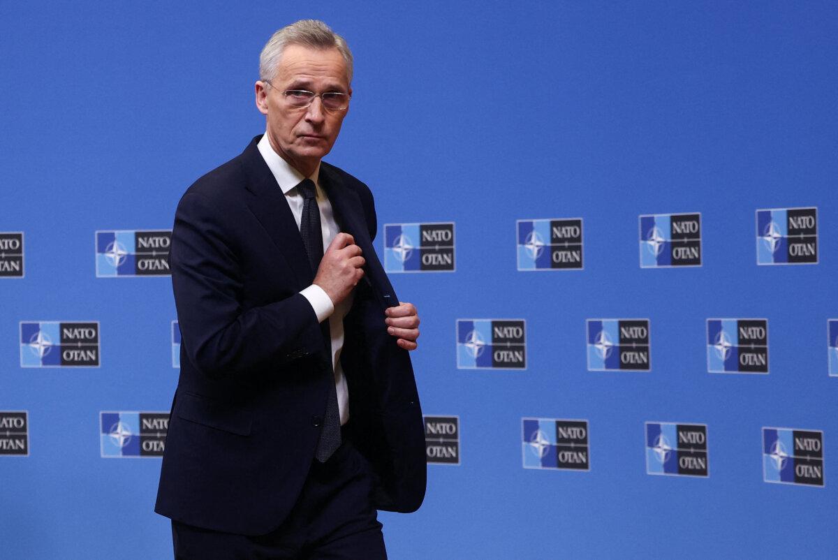 NATO Secretary General Jens Stoltenberg leaves after a press conference ahead of NATO Defence Ministers' meeting at the Alliance's headquarters in Brussels, Belgium, on Feb. 14, 2024. (Yves Herman/Reuters)
