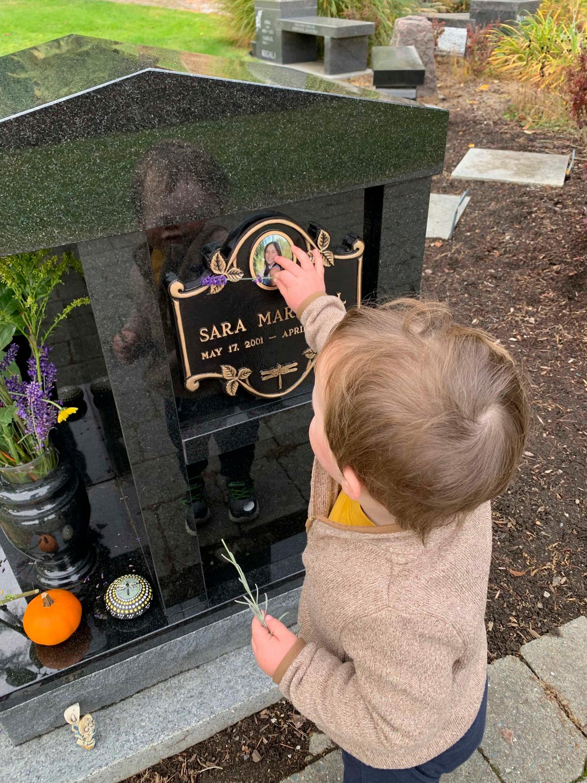 Lochlan, 2, at his mother's graveside memorial. (Courtesy of Lisa Marshall)