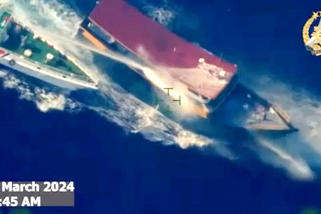 Chinese Coast Guard Hits Philippine Boat With Water Cannons in Disputed Sea, Causing Injuries