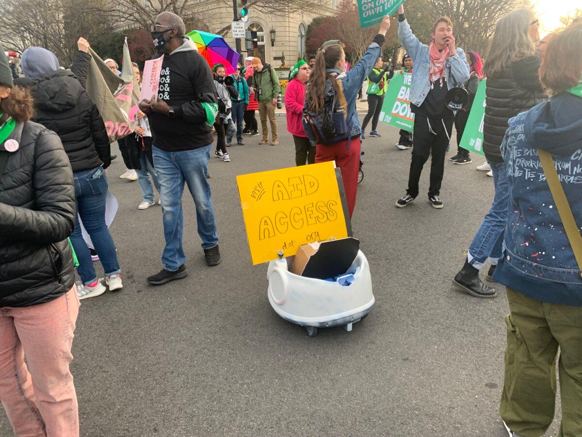 Pro-abortion protesters outside the Supreme Court ahead of a challenge to abortion pill access on March 26, 2024. (Sam Dorman/The Epoch Times)