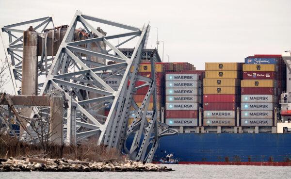 The cargo ship Dali sits in the water after running into and collapsing the Francis Scott Key Bridge in Baltimore, Md., on March 26, 2024. (Kevin Dietsch/Getty Images)