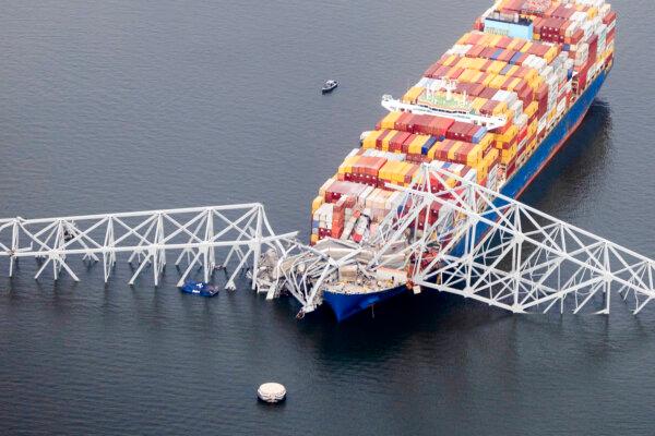 Cargo ship Dali sits in the water after striking the Francis Scott Key Bridge in Baltimore, Md., on March 26, 2024 (Tasos Katopodis/Getty Images)