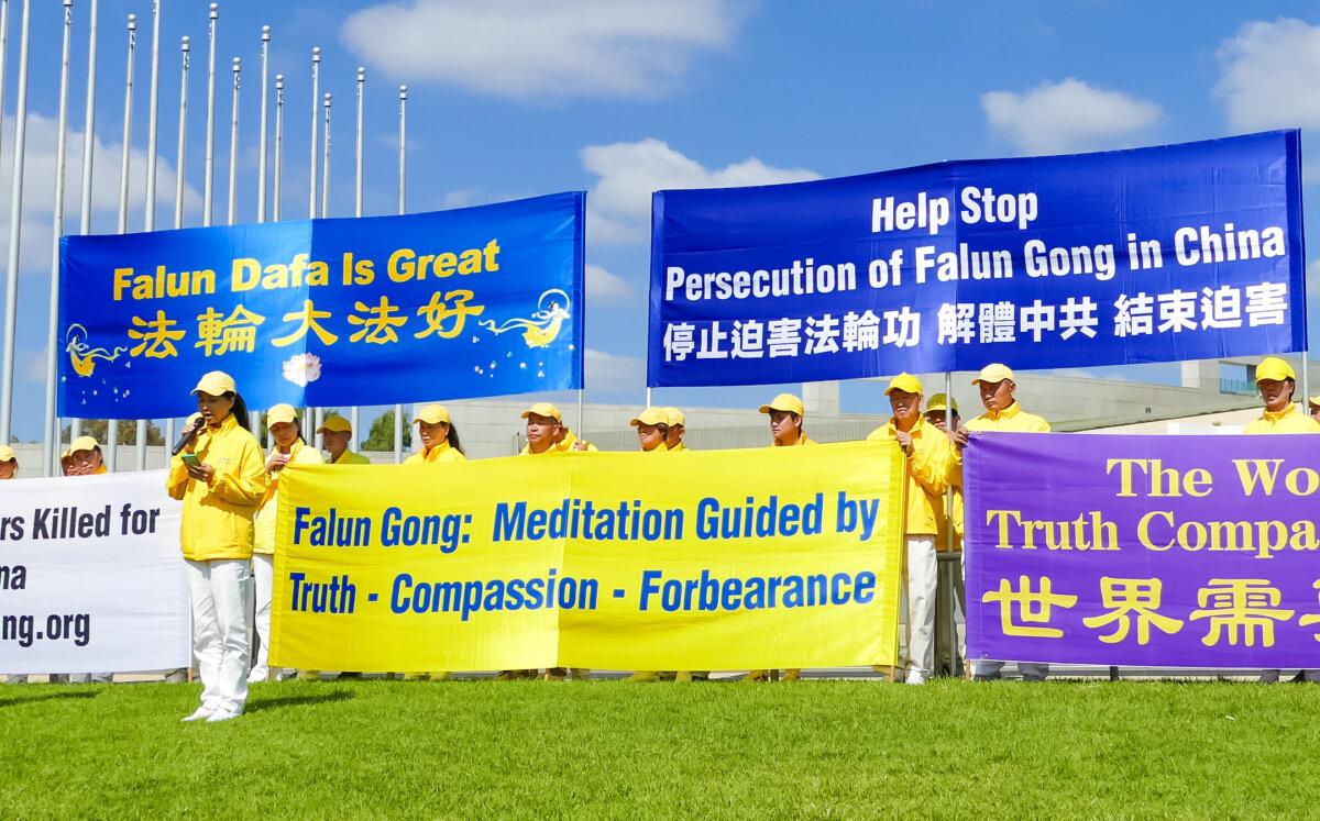 Liu Li, whose family members in China were arrested for their spiritual beliefs, speaks at a rally held by Falun Gong practitioners in Canberra, Australia, on March 27, 2024. (The Epoch Times)