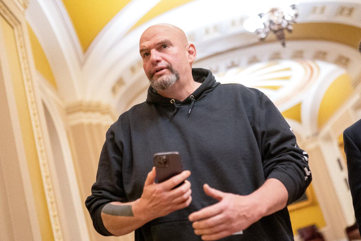 U.S. Sen. John Fetterman (D-Pa.) walks toward the Senate Chambers in Washington on March 23, 2024. (Nathan Howard/Getty Images)