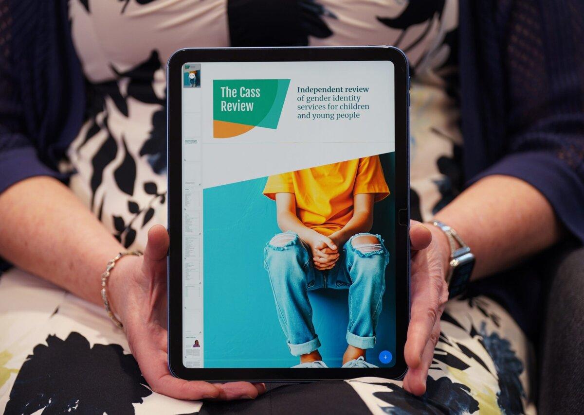 Retired consultant paediatrician Dr. Hilary Cass holding a digital copy of her review of gender care of children and young people, in London, on April 9, 2024. (Yui Mok/PA)
