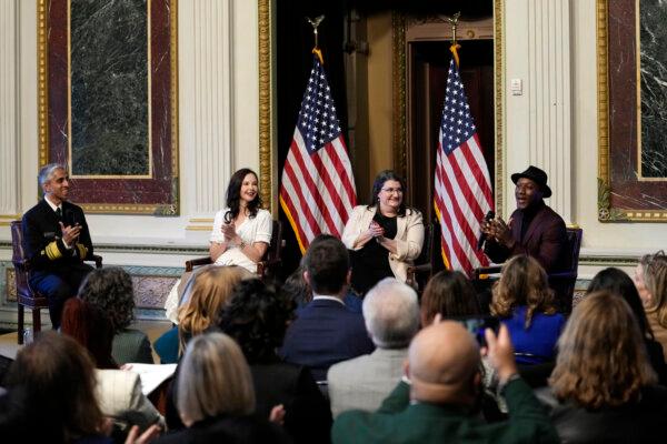 Singer-songwriter Aloe Blacc, right, sings during an event with notable suicide prevention advocates on the White House complex in Washington on April 23, 2024. He is joined by, from left, Surgeon General Dr. Vivek Murthy, Ashley Judd, and Shelby Rowe, executive director of the Suicide Prevention Research Center. The White House held the event on the day they released the 2024 National Strategy for Suicide Prevention to highlight efforts to tackle the mental health crisis and beat the overdose crisis. (Susan Walsh/AP Photo)