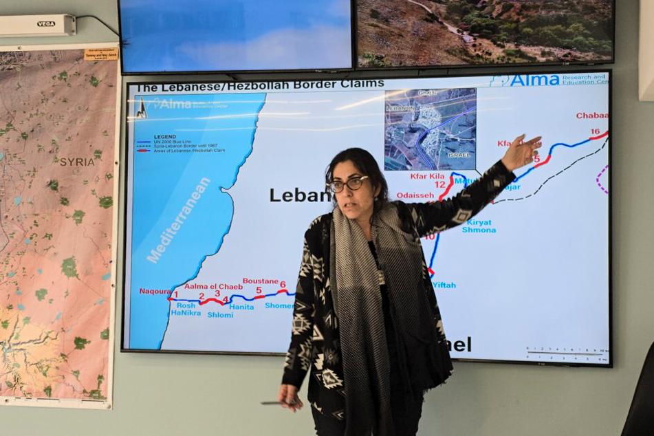 Sarit Zehavi of the Alma Center in Israel's Tefen Industrial Zone lectures visitors about the Israel–Hezbollah border faceoff on March 13, 2024. (Dan M. Berger/The Epoch Times)