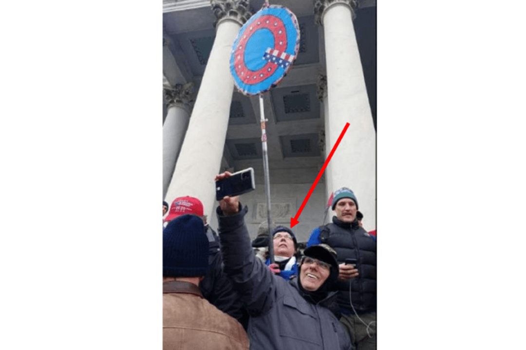 Woman Who Held ‘Q’ Sign on Jan. 6 Convicted by Jury