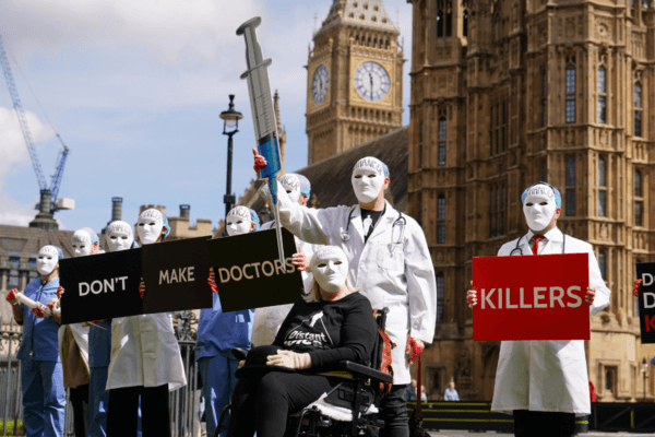 Campaigners protest outside Parliament ahead of a debate in the House of Commons on assisted dying in Westminster, London, on April 29, 2024. (Jordan Pettitt/PA Wire)