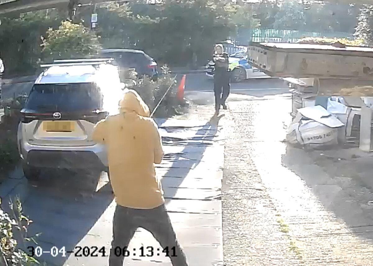 An image from a doorbell camera of police officers using a stun gun on a sword-wielding man in Hainault, east London, on April 30, 2024. (PA)