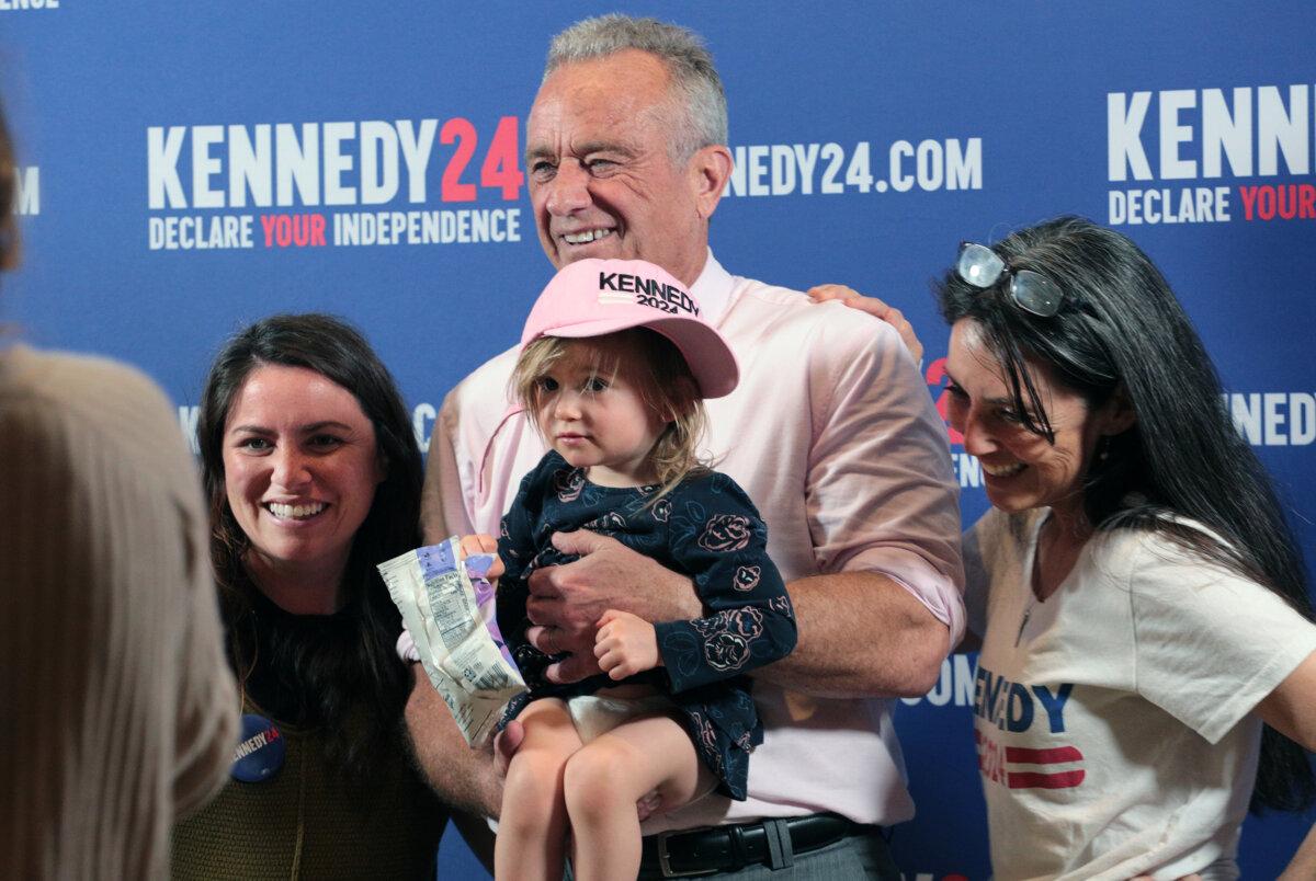 Robert F. Kennedy Jr. poses for a selfie with supporters after a voter rally in Holbrook, N.Y., on April 28, 2024. (Richard Moore/The Epoch Times)