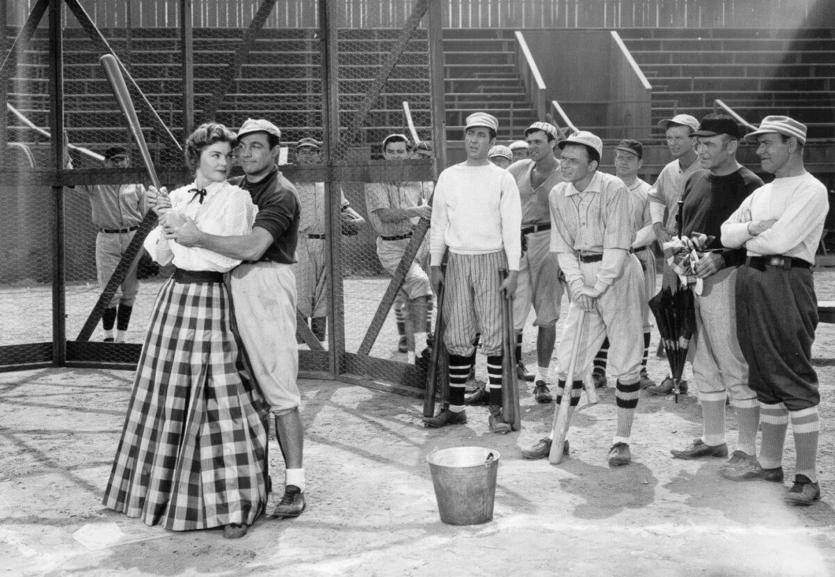 (L–R) K.C. Higgins (Esther Williams), Eddie O'Brien (Gene Kelly), Nat Goldberg (Jules Munshin), and Dennis Ryan (Frank Sinatra), in “Take Me Out to the Ball Game.” (MGM)