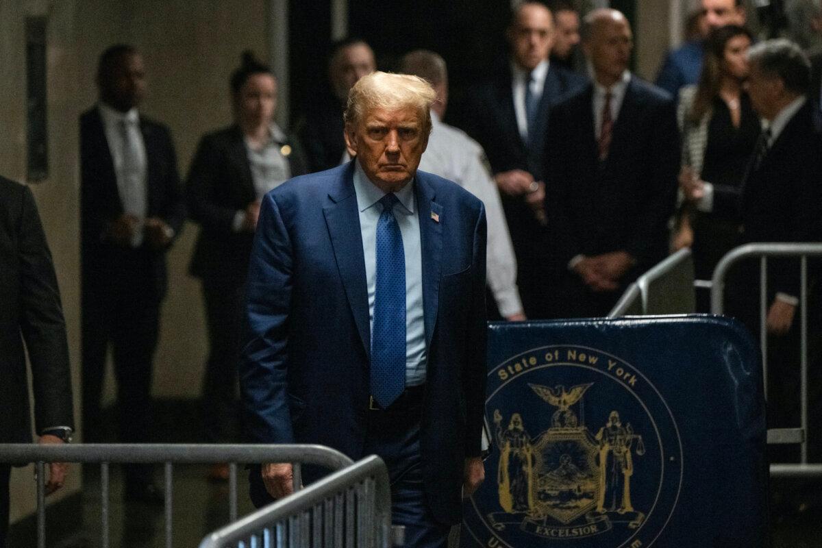 Former U.S. President Donald Trump walks toward the press to speak as he arrives for his trial for allegedly covering up hush money payments linked to extramarital affairs, at Manhattan Criminal Court in New York City, on May 9, 2024. (Victor J. Blue / POOL / AFP)