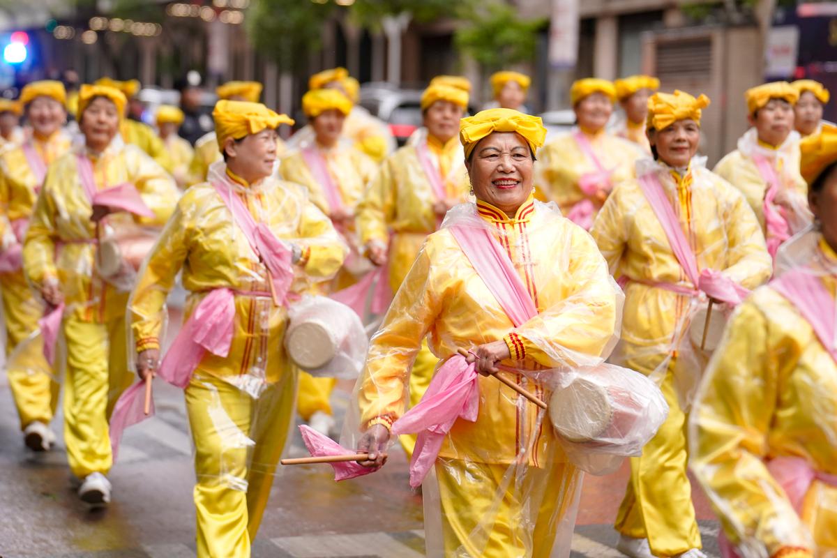 Falun Gong practitioners participate in a parade to celebrate World Falun Dafa Day in New York City on May 10, 2024. (Samira Bouaou/The Epoch Times)
