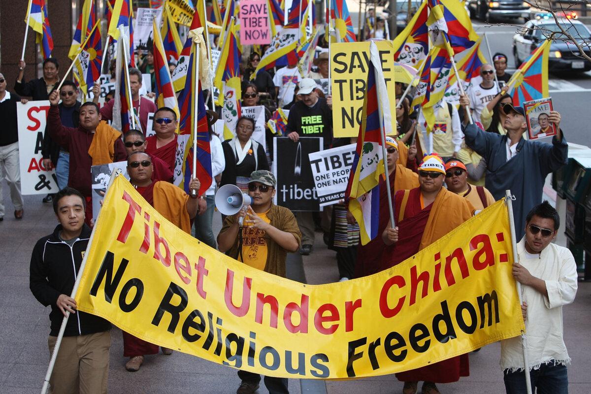 Members and supporters of the Tibetan Association of Southern California and Los Angeles Friends of Tibet march on the 50th anniversary of the first Tibetan uprising against Chinese rule and the escape of the 14th Dalai Lama into exile in Los Angeles on March 10, 2009. (David McNew/Getty Images)