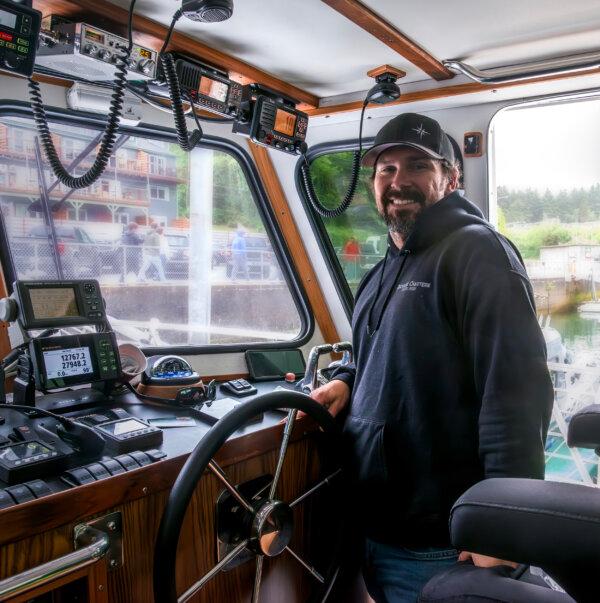 Captain Tyler Turner at the helm of his charter fishing boat docked in Depoe Bay. (Maria Coulson)