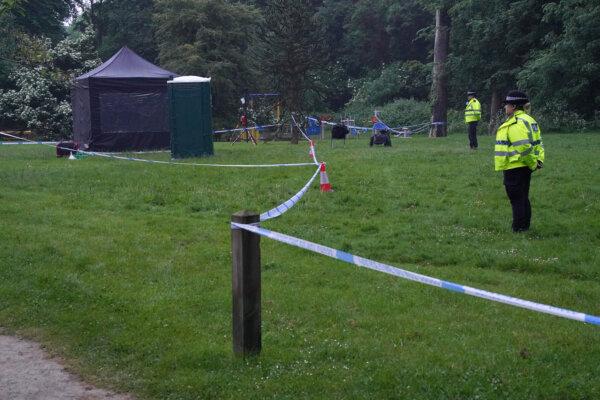 Police next to a black forensics tent in Grenfell Park, Maidenhead where Matthew Trickett was found dead on May 19, in Berkshire, England, on May 21, 2024. (Jonathan Brady/PA)