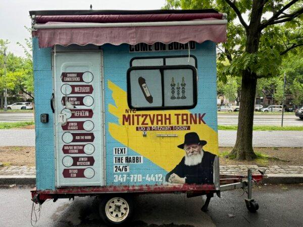 “Mitzvah tanks” are portable education and outreach centers and “mini-synagogues” used by Chabad-Lubavitch Hasidism. This one, with a portrait of the Rebbe, is smaller than most. Others resemble motor homes. (Courtesy of Roger L. Simon)