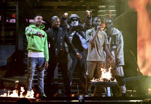 Fredo—real name Marvin Bailey (L, in light green top)—with (L to R) Giggs, Meekz, Dave, and Ghetts, performing at the BRIT Awards at the O2 Arena in London on Feb. 8, 2022. (Gareth Cattermole/Getty Images)