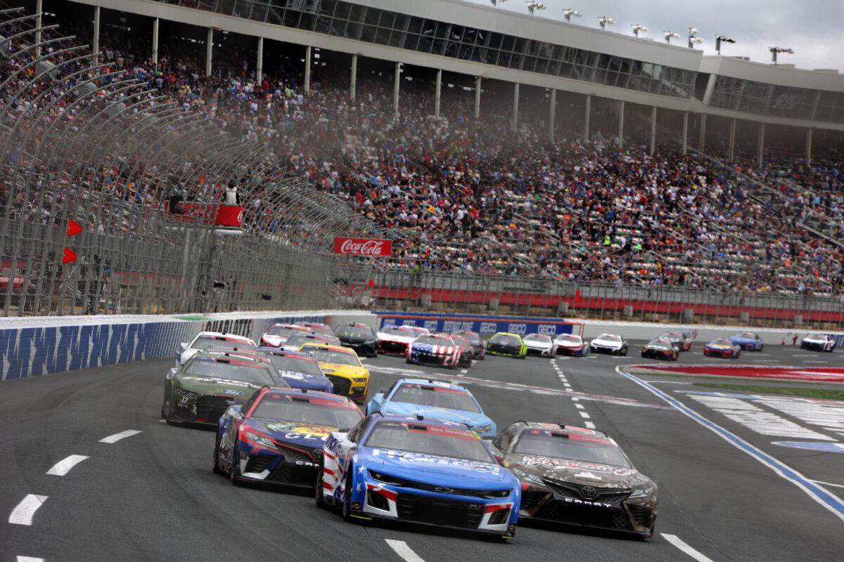 Kyle Larson, driver of the #5 HendrickCars.com Patriotic Chevrolet, leads a pack of cars during the NASCAR Cup Series Coca-Cola 600 at Charlotte Motor Speedway in Concord, North Carolina on May 29, 2023. (Keenan Hairston/Getty Images)
