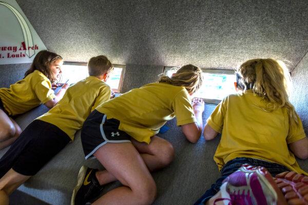 Students visiting the Gateway Arch in St. Louis struggle to get a good view through the tiny windows at the top. (Joe Sohm/Dreamstime)