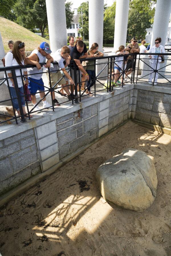 People who come to see Plymouth Rock in Plymouth, Mass., are often surprised at how small it is. (Marcos Souza/Dreamstime)