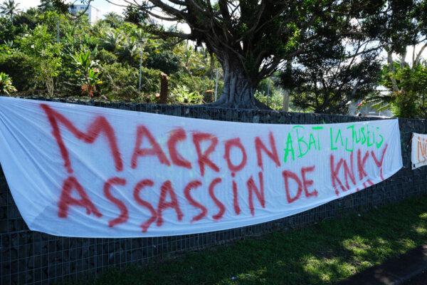 Banners set up along a road following a visit by French President Emmanuel Macron in Noumea, New Caledonia, on May 24, 2024. (Theo Rouby/AFP via Getty Images)