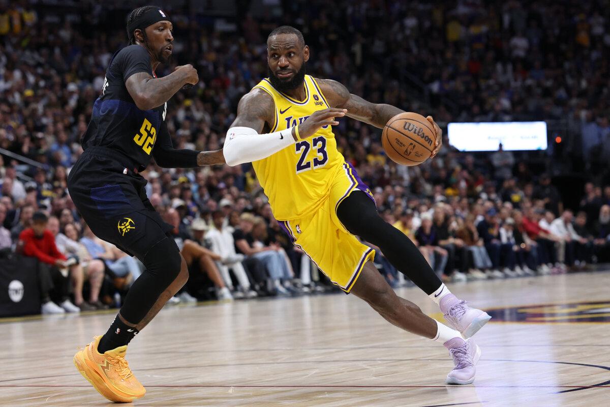 LeBron James #23 of the Los Angeles Lakers drives against Kentavious Caldwell-Pope #5 of the Denver Nuggets in the fourth quarter during game two of the Western Conference First Round Playoffs at Ball Arena in Denver, Colorado on April 22, 2024. (Matthew Stockman/Getty Images)