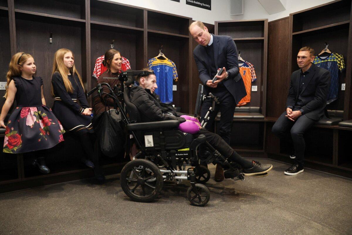 Rob Burrow is made a CBE by the prince of Wales, with Kevin Sinfield and Lindsey Burrow and children Maya (left) and Macy, in January 2024. (Phil Noble/PA)