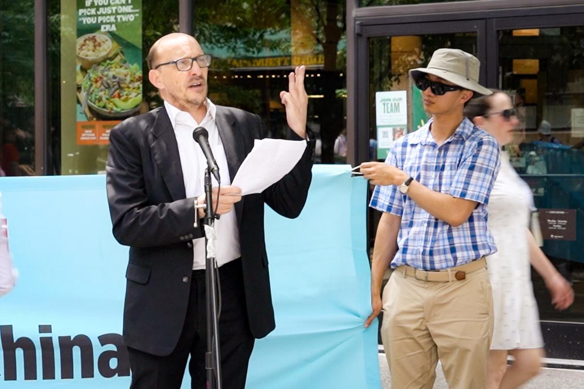 Mark Thomas, professor and Chair of the Department of Political Science at La Salle University, speaks at a rally outside the American Transplant Congress 2024 in Philadelphia on June 2, 2024. (Andrew Li/The Epoch Times)
