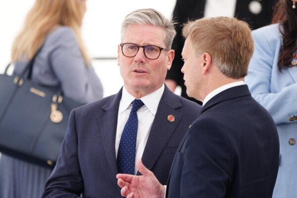 Labour leader Sir Keir Starmer (L) speaking with Defence Secretary Grant Shapps (R) ahead of the UK national commemorative event for the 80th anniversary of D-Day at the British Normandy Memorial in Ver-sur-Mer, France, on June 6, 2024. (Jane Barlow/PA)